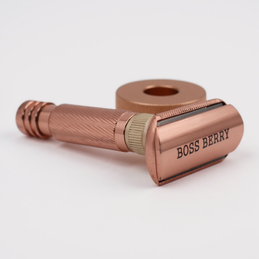 Rose gold safety razor with 'BOSS BERRY' branding on a white background