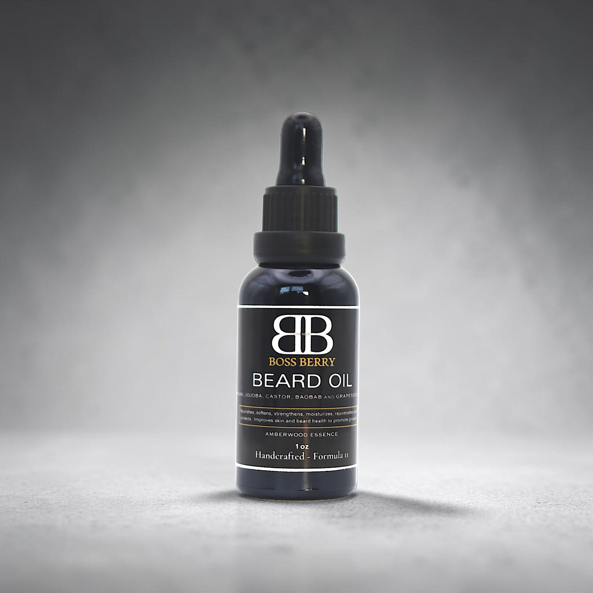Bottle of Boss Berry beard oil on a gray background